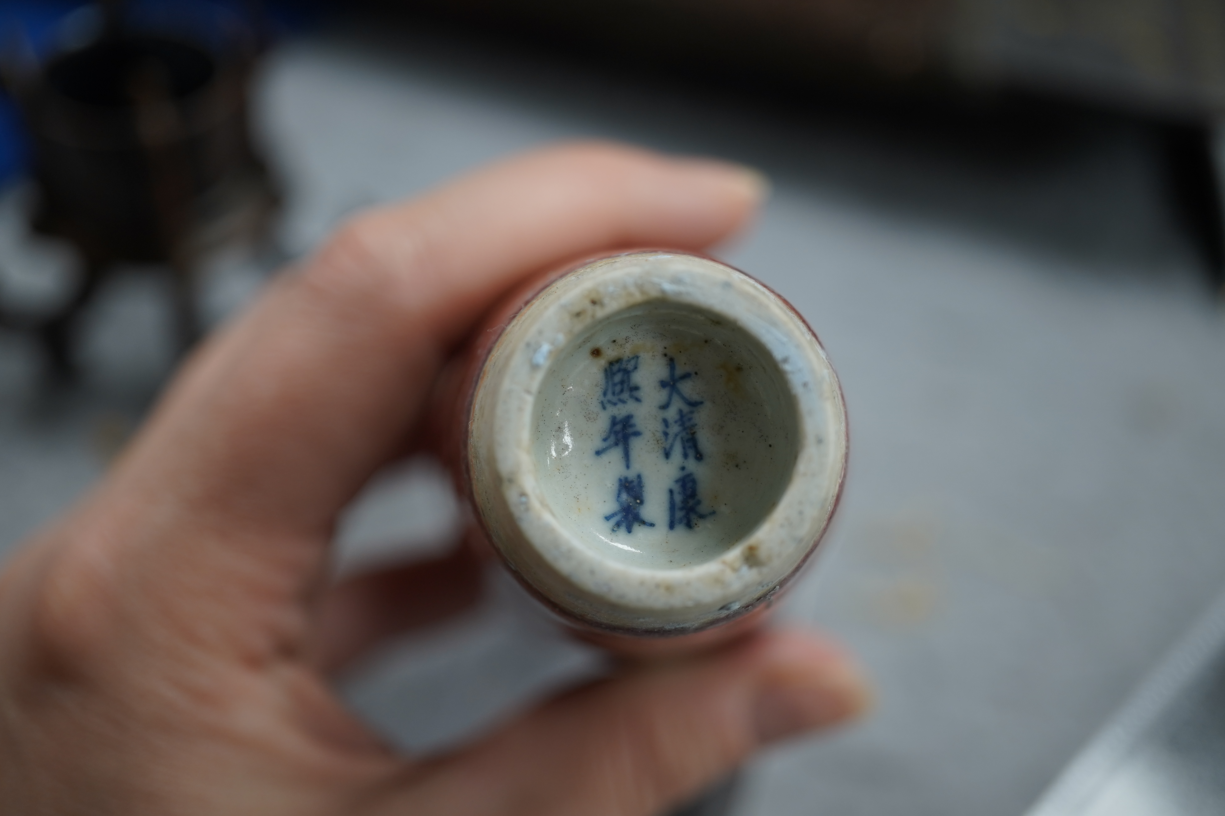 A small Chinese peach bloom glazed vase with fitted wood stand, Republic period